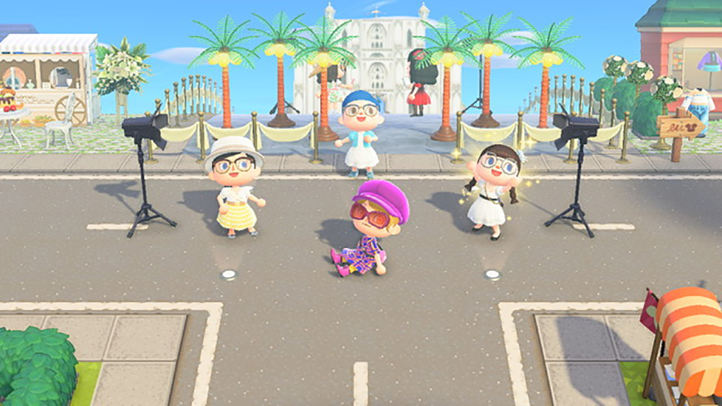 Screenshot from Animal Crossing: New Horizons featuring characters participating in a virtual fashion show. The scene is set on a sunny street with palm trees and decorative backgrounds. The characters are dressed in stylish outfits, posing and walking on a makeshift runway, highlighting the intersection of fashion and gaming